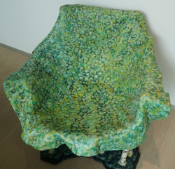 This a mixed media chair, with a mirror as a lake.