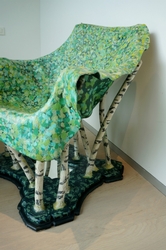 This a mixed media chair, with a mirror as a lake.
